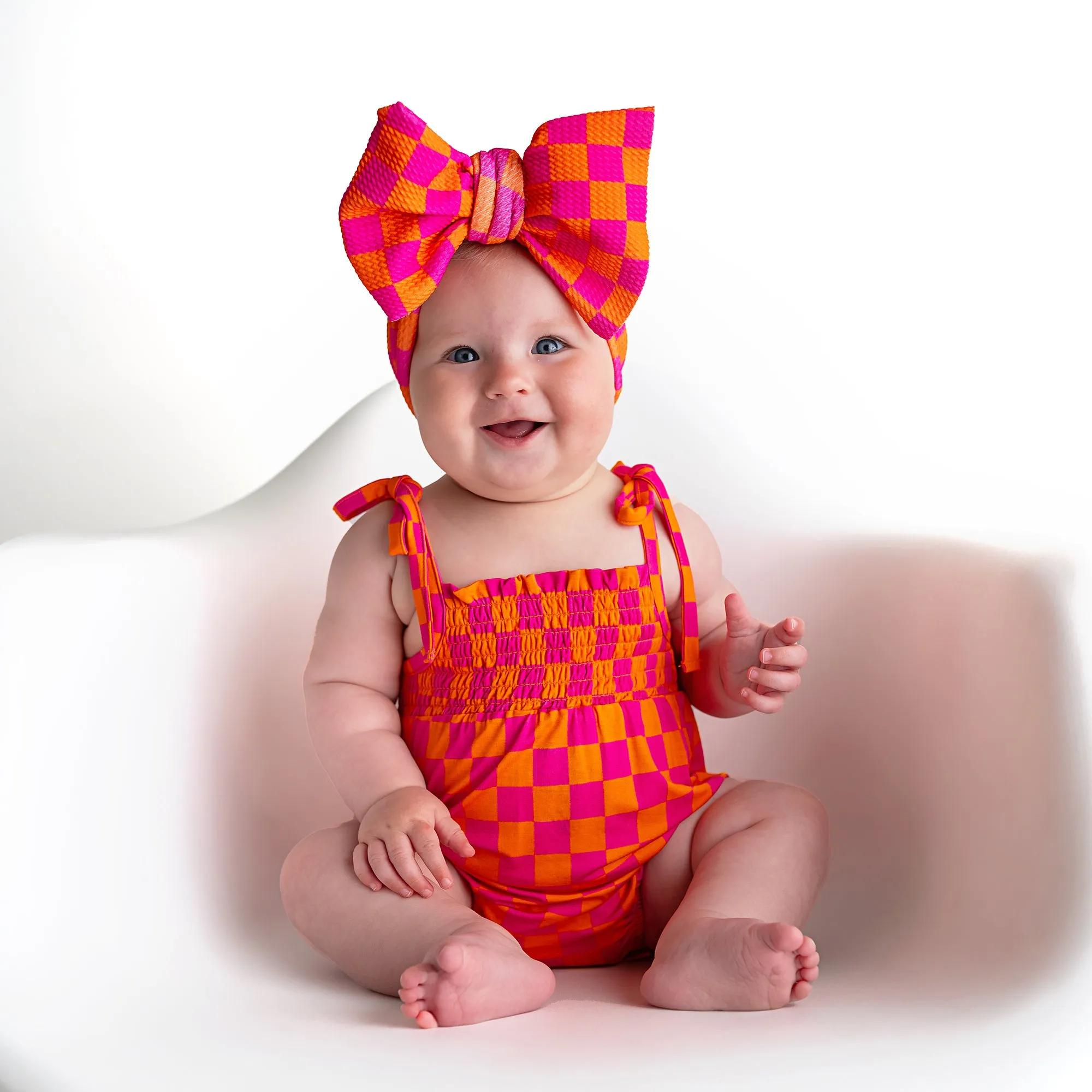 Eric Orange SMOCKED BUBBLE ROMPER