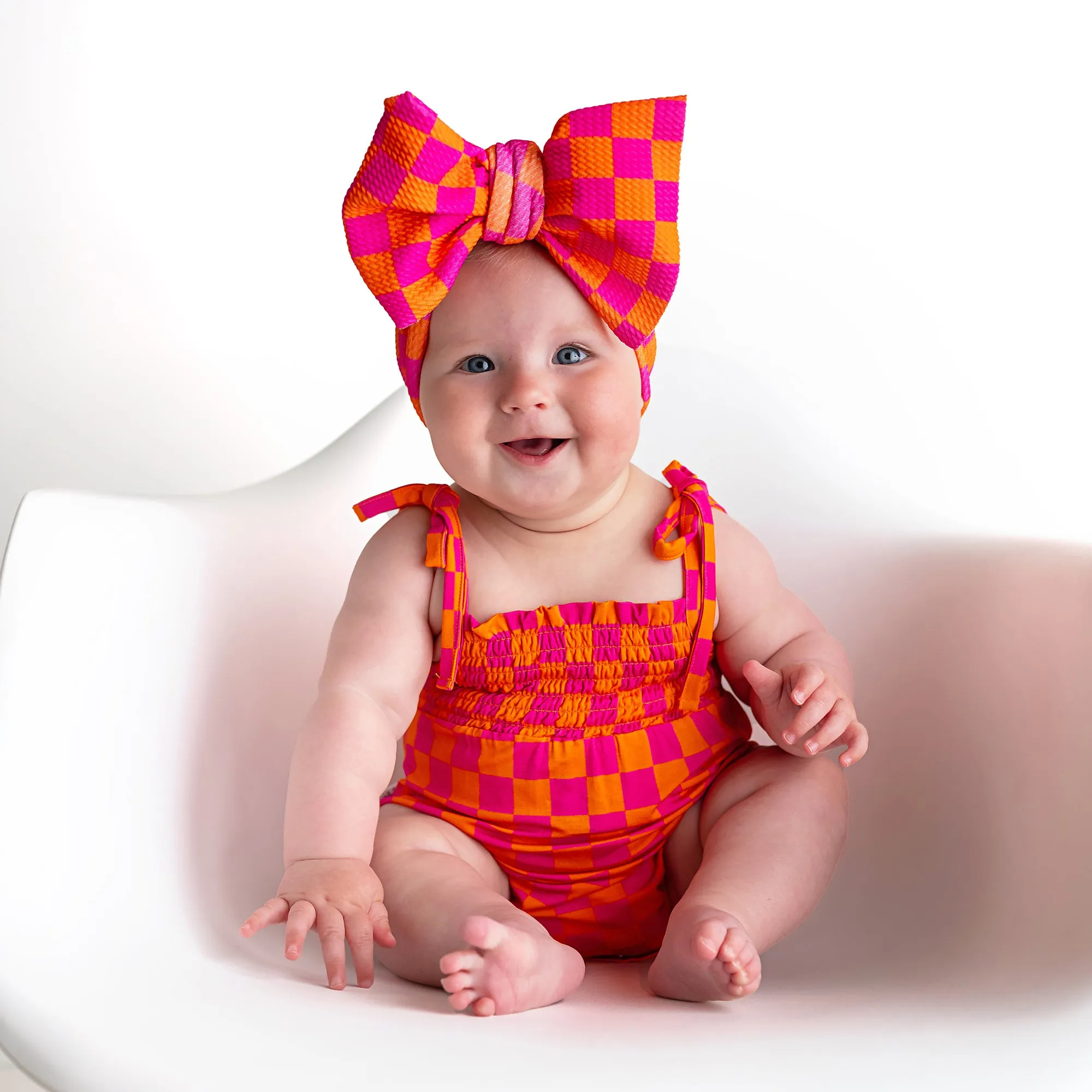 Eric Orange SMOCKED BUBBLE ROMPER
