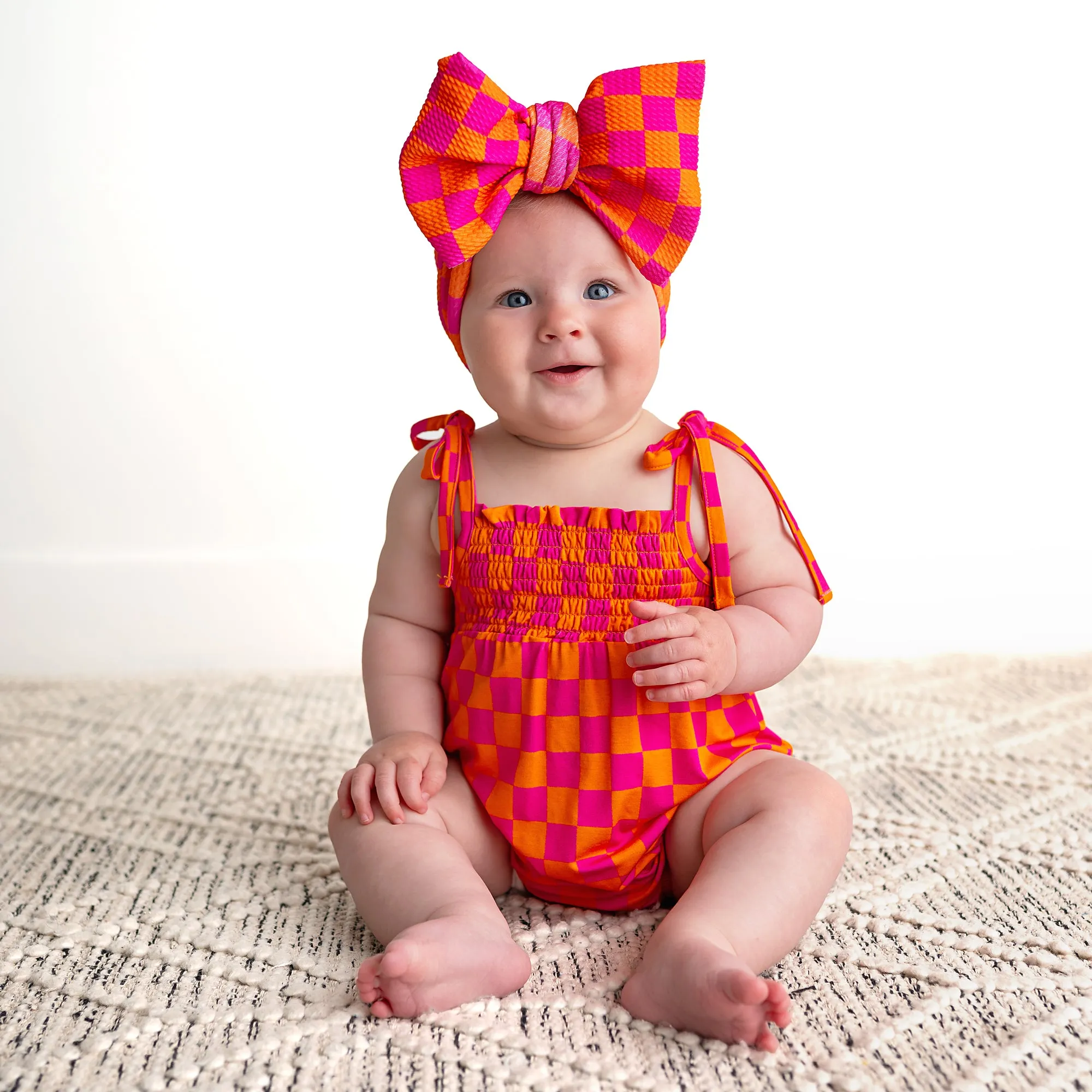 Eric Orange SMOCKED BUBBLE ROMPER